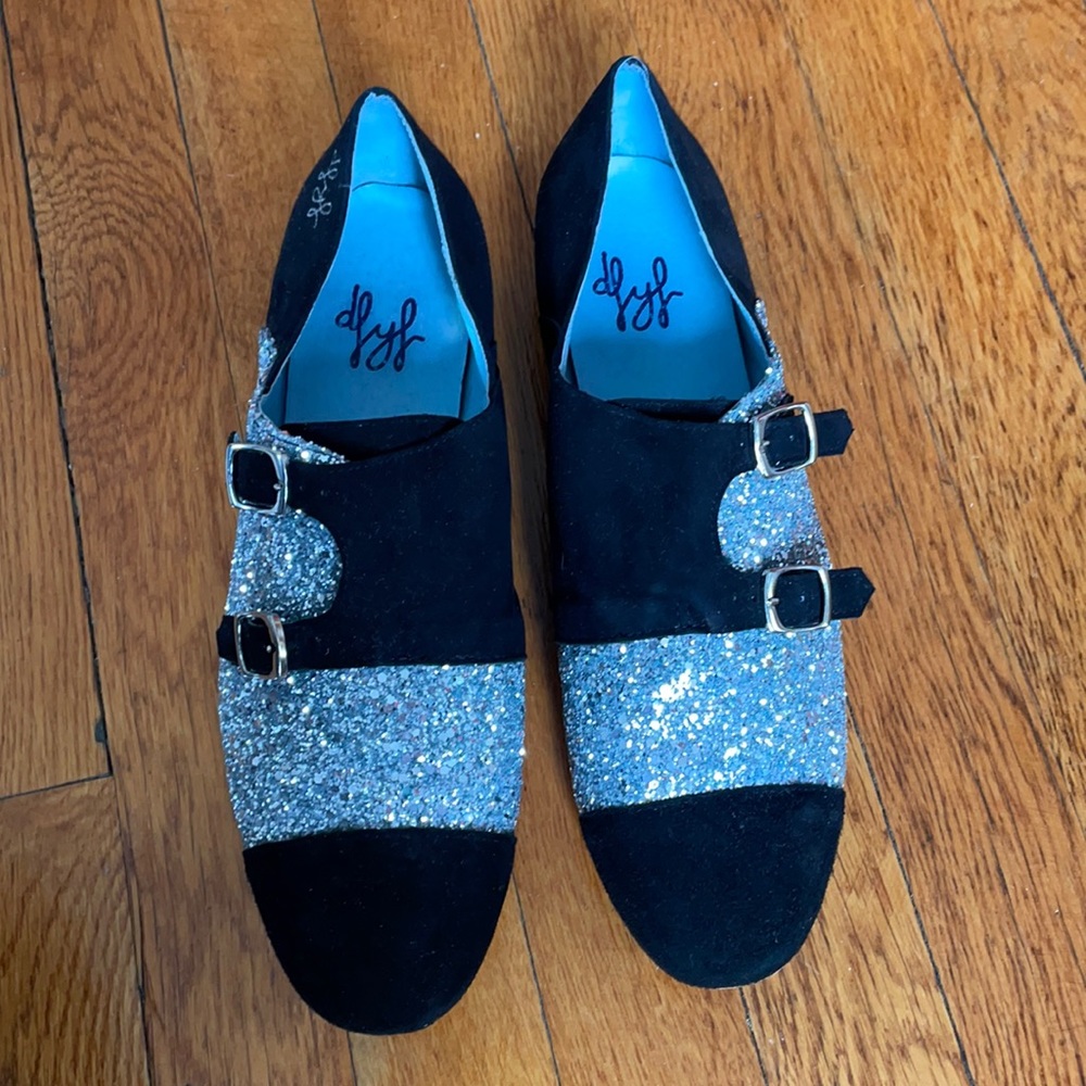 Black and silver glitter shoes.